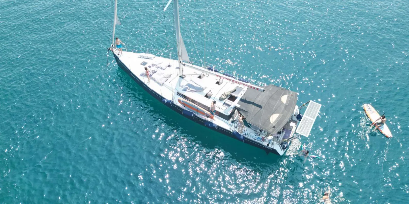 Sailboat under full sail on the Ionian Sea off the coast of Catania